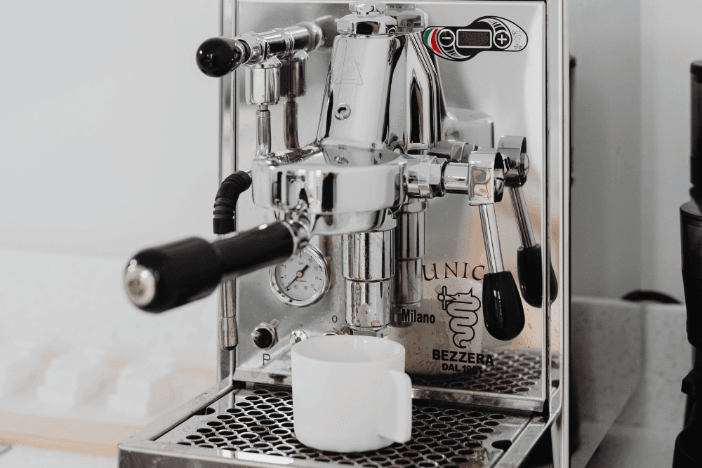 Stainless steel espresso machine with group head, portafilter, steam wand and pressure gauge