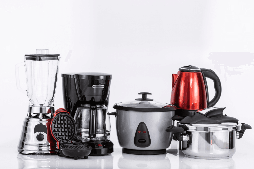 Assortment of small kitchen appliances: blender, coffee maker, waffle maker, rice cooker, kettle and pressure cooker